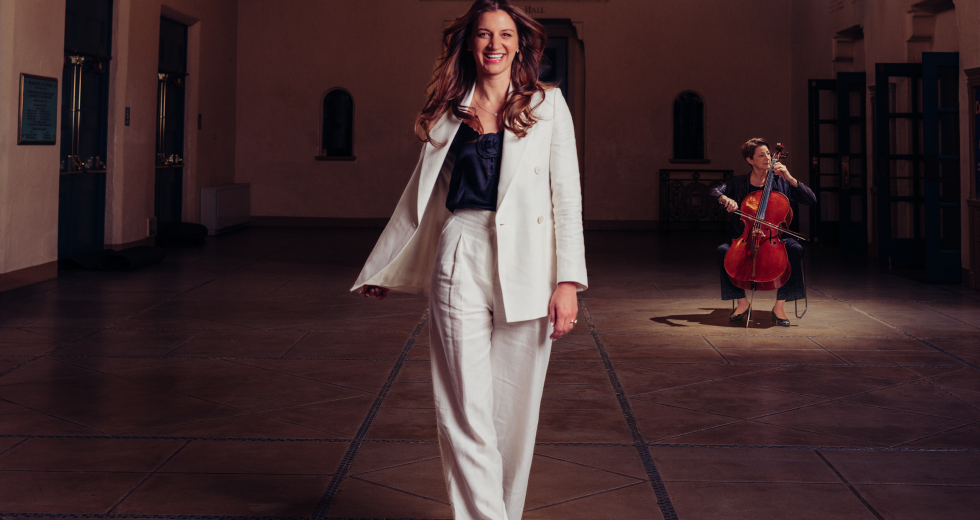Sadie St. Lawrence, founder of HMCI, poses in Memorial Auditorium with Sacramento Philharmonic cellist Susan Lamb Cook. (Photo by Francisco Chavira)