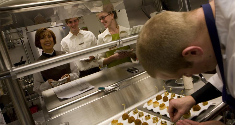 Kitchen staff plates hors d'oeuvres on the Ritz-Carlton's opening day