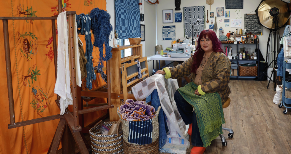 Jamie Pesquiza Cardenas sits at her loom in the shared studio she was able to access with her Creative Growth Award. (Photos by Melissa LuVisi)