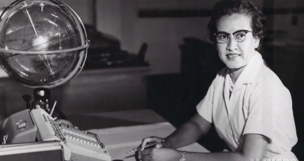 NASA research mathematician Katherine Johnson is photographed at her desk at NASA Langley Research Center with a globe, or "Celestial Training Device." (Public domain by NASA)
