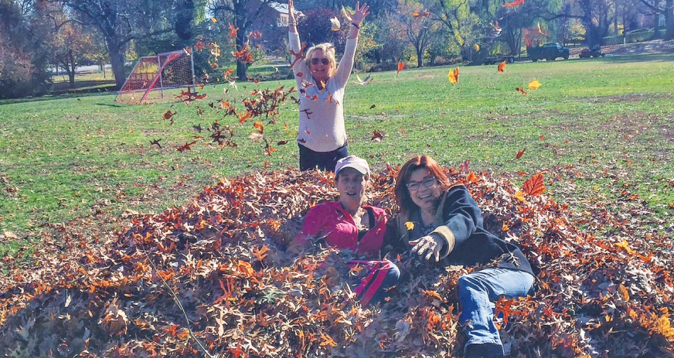 Comstock's Editor Judy Farah enjoys a New Jersey leaf pile with two longtime friends.