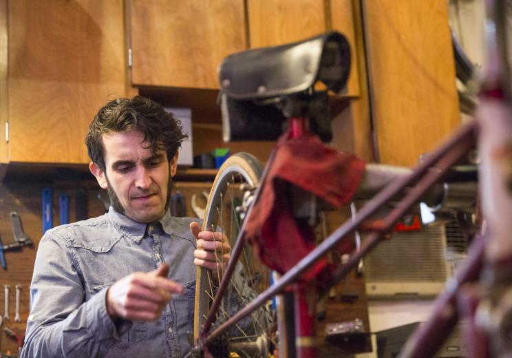 Here, he works on a Motobecane French city bike circa 1960. Quarles estimates a bicycle’s age based on parts like derailleurs, wheels and the seat, as well as decals on the frame. Here, he works on a Motobecane French city bike circa 1960. Quarles estimates a bicycle’s age based on parts like derailleurs, wheels and the seat, as well as decals on the frame.