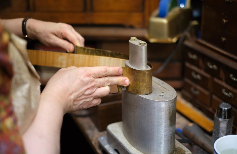 Eventually, she cuts out the scroll, the decoratively carved beginning of the violin’s neck on which the fingerboard is mounted. After completing more steps over several months, she selects the varnish, and the finished violin will sell for $10,000.