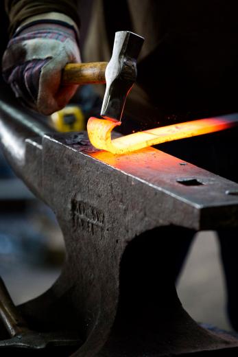 He is an artist at heart, and his Fe Gallery, also on the premises, showcases artistic metalwork and often holds demonstrations on Second Saturday. “I come to work because it’s fun,” Lyman says. “I’m project-minded, so if I get an art project in mind, some other things suffer until I’m finished with that piece.” Here, he uses a blacksmithing power hammer to forge a decorative element for a gate. He is an artist at heart, and his Fe Gallery, also on the premises, showcases artistic metalwork and often holds demonstrations on Second Saturday. “I come to work because it’s fun,” Lyman says. “I’m project-minded, so if I get an art project in mind, some other things suffer until I’m finished with that piece.” Here, he uses a blacksmithing power hammer to forge a decorative element for a gate.