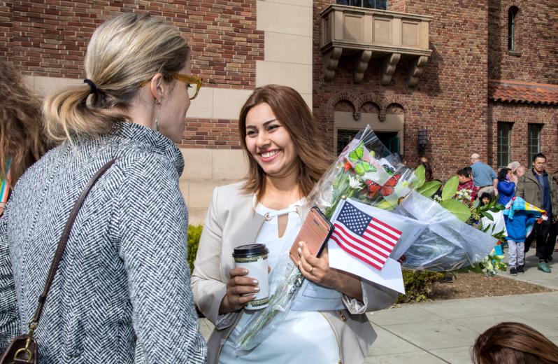 Zuhal receives congratulations from Joy Justus, who works at World Relief, where Khaleel is a caseworker helping refugees settle in Sacramento.