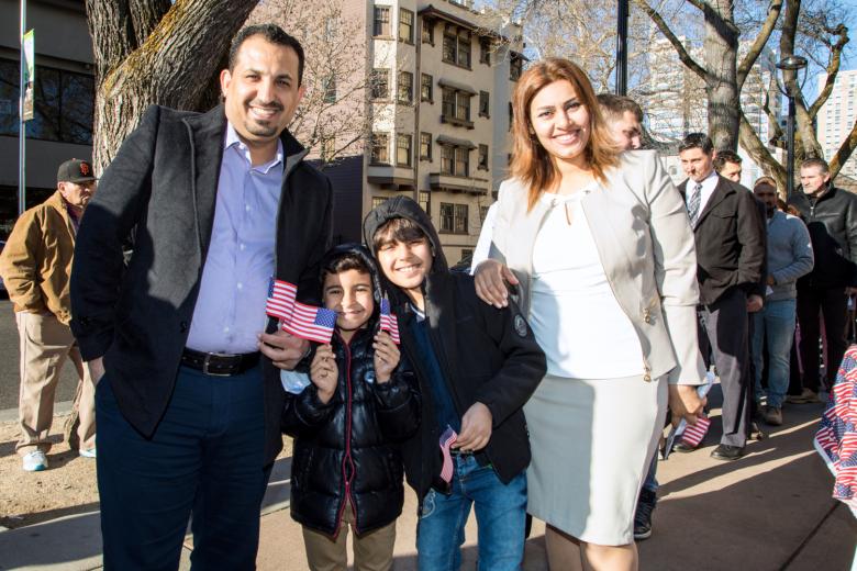 Khaleel Yasir and his wife, Zuhal Al Ameen, stand in a long line with sons Zain and Mostafa. They came to Sacramento from Iraq on a Special Immigrant Visa in 2012, and daughter Baan (not with them) was born here the following year.