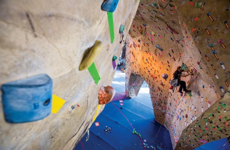 “We’re like that guy in ‘Labyrinth.’ We’re David Bowie,” says routesetter Bennett Dahl. Josh Foster (pictured) has been setting routes for the past seven years and says it’s a job that can be physically demanding, requiring a significant amount of core strength to navigate certain portions of the wall while toting a 40-pound bag of equipment. “We’re like that guy in ‘Labyrinth.’ We’re David Bowie,” says routesetter Bennett Dahl. Josh Foster (pictured) has been setting routes for the past seven years and says it’s a job that can be physically demanding, requiring a significant amount of core strength to navigate certain portions of the wall while toting a 40-pound bag of equipment.