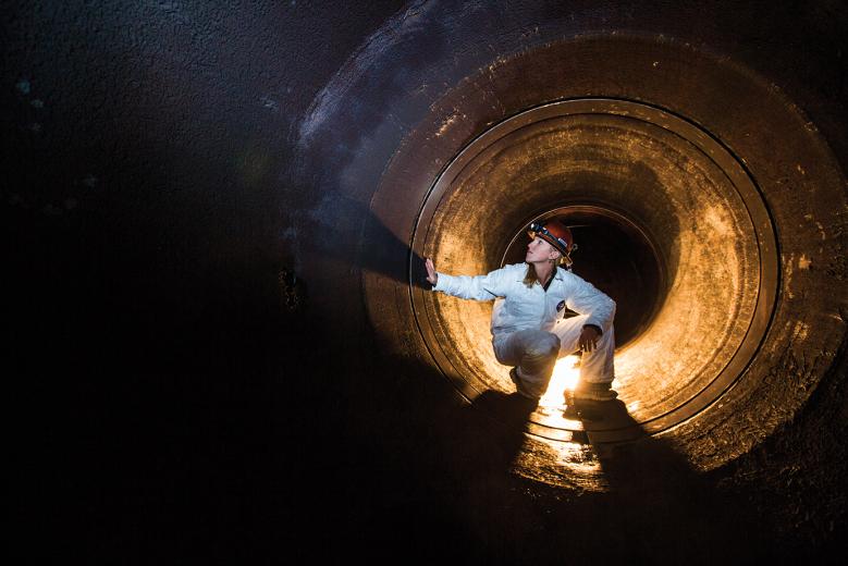 Karen Case, a mechanical engineer with SMUD, inspects the inner workings of an intake structure that funnels water to a generation turbine at Jaybird Firehouse in the Upper American River watershed. Karen Case, a mechanical engineer with SMUD, inspects the inner workings of an intake structure that funnels water to a generation turbine at Jaybird Firehouse in the Upper American River watershed.
