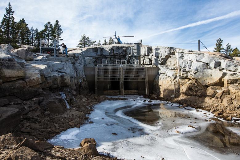 Regular and ongoing assessments of water flows are essential to maintaining the performance of SMUD’s hydroelectric system. Here, at Buck Island Dam and Reservoir, SMUD hydrographers Dan Lund and Grant Winslow make flow verification measurements. Regular and ongoing assessments of water flows are essential to maintaining the performance of SMUD’s hydroelectric system. Here, at Buck Island Dam and Reservoir, SMUD hydrographers Dan Lund and Grant Winslow make flow verification measurements.