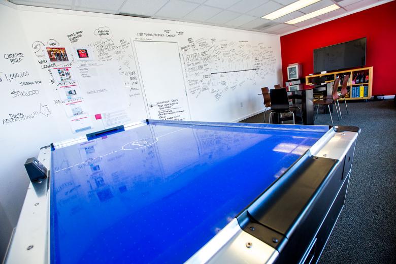 Morning power meeting over air hockey? Perhaps a round of old-school Asteroids with a mid-morning espresso is more your thing. The clean brightness of Fuel Creative’s offices is peppered with interactive features — a marriage of analog and modern aesthetic. “Fuel is very eclectic in everything we do, and we like to try new things so we were our own designers,” says firm Principal and Art Director Brent Rector. Morning power meeting over air hockey? Perhaps a round of old-school Asteroids with a mid-morning espresso is more your thing. The clean brightness of Fuel Creative’s offices is peppered with interactive features — a marriage of analog and modern aesthetic. “Fuel is very eclectic in everything we do, and we like to try new things so we were our own designers,” says firm Principal and Art Director Brent Rector.