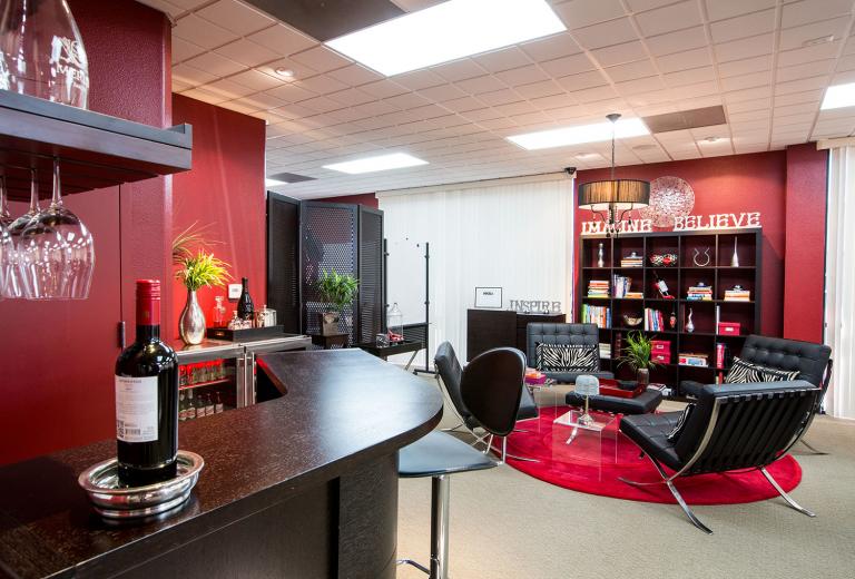 The modern yet warmly sophisticated common space at Merlot Marketing exudes the charm and culture the company revels in. Company CEO Debi Hammond designed and decorated the office herself: “In agency life, we often spend more time here than at our homes. It’s welcoming for the team and clients, who love having meetings in a space that enhances creativity and makes you smile.” The modern yet warmly sophisticated common space at Merlot Marketing exudes the charm and culture the company revels in. Company CEO Debi Hammond designed and decorated the office herself: “In agency life, we often spend more time here than at our homes. It’s welcoming for the team and clients, who love having meetings in a space that enhances creativity and makes you smile.”