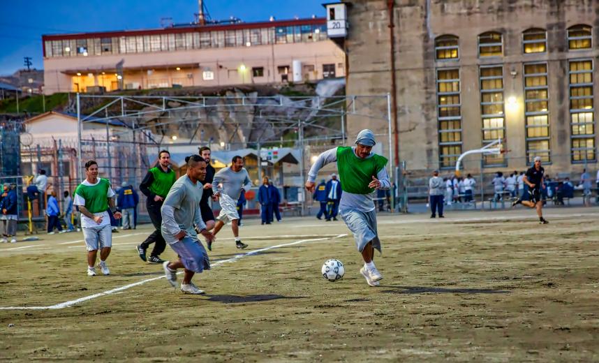 Prison yard game action in February. “The ball believes in you no matter who you are,” inmate Aaron Thomas Lamphere wrote to Sacramento Republic FC after his release last year. “If the world took the time to understand that simple wisdom, from a simple ball, I cannot help but think what a better world it would be.” (Photo by Steve Martarano)