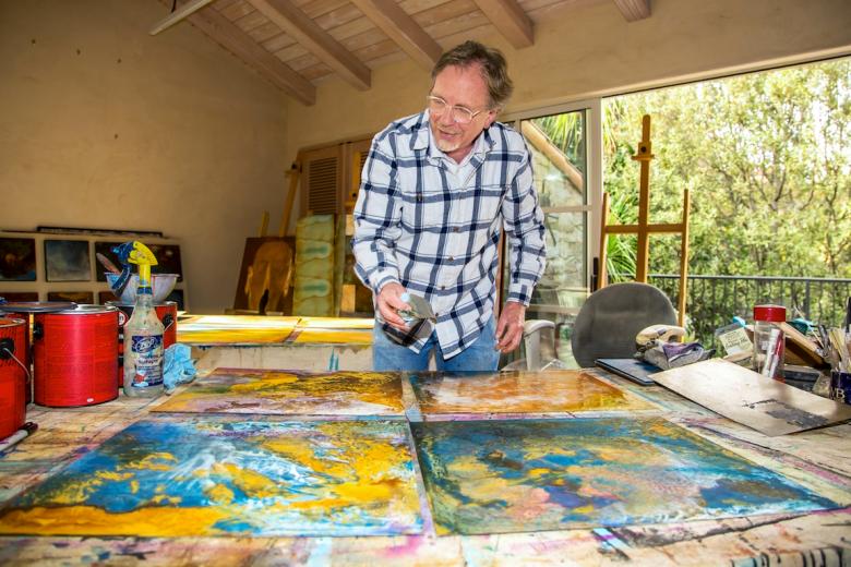 After spraying steel panels with vinegar to promote rust, artist William Ishmael then applies layers of paint After spraying steel panels with vinegar to promote rust, artist William Ishmael then applies layers of paint