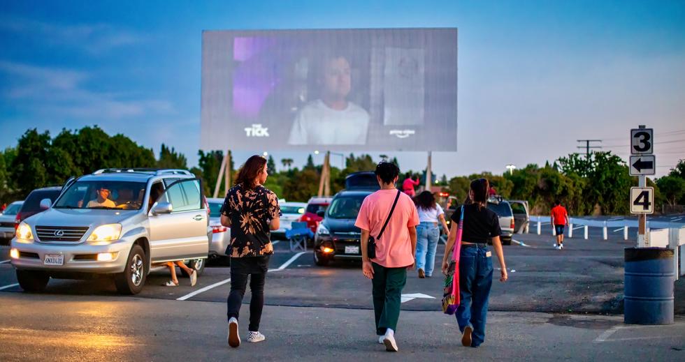 Moviegoers head from the snack bar to the parking lot where “Aladdin” is beginning. Moviegoers head from the snack bar to the parking lot where “Aladdin” is beginning.