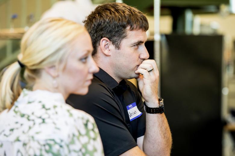 Kelsea Cummings helps her husband, Adrian, with the pitch for his bicycle lights invention.