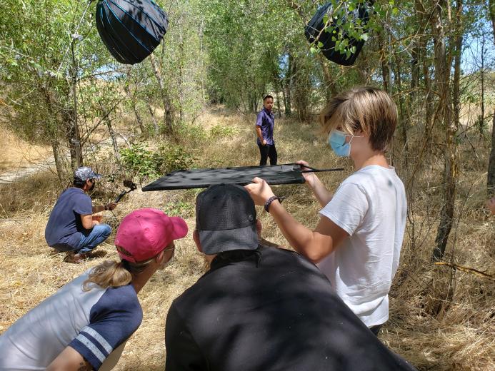The Comstock’s team of videographer Jason Barangue, Art Director Carly Cornejo, photographer Terence Duffy and assistant Logan Duffy collaborate during the photo shoot of Kevin Phan, founder, president and CEO of the Capital Asian American Professional Society and CAAPS Foundation.