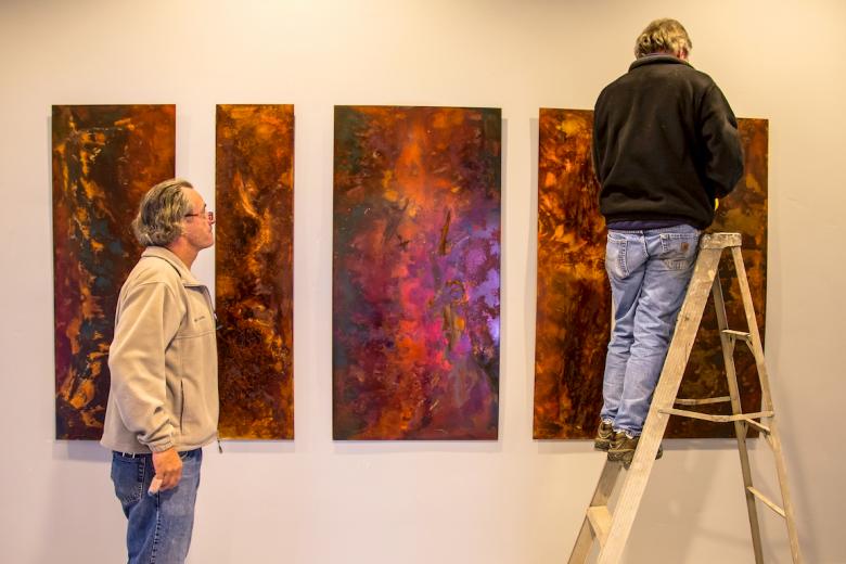 Ishmael's final products are visible in the hallway behind the WAL community room Ishmael's final products are visible in the hallway behind the WAL community room