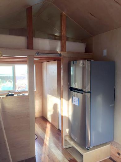 An in-progress view of the office and kitchen areas with wall panels and cabinetry made from custom Baltic Birch An in-progress view of the office and kitchen areas with wall panels and cabinetry made from custom Baltic Birch