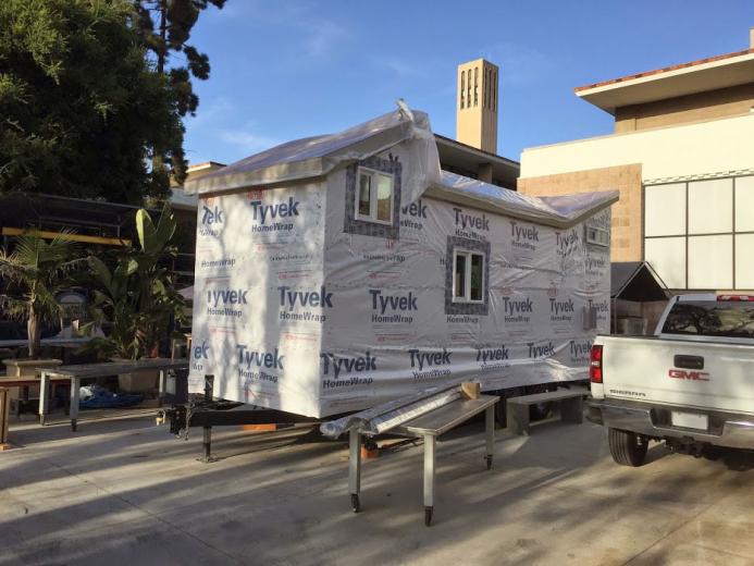 The building wrapped with Tyvek vapor barrier, waiting for the roof. The building wrapped with Tyvek vapor barrier, waiting for the roof.
