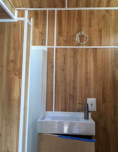 View of the bathroom sink and shower stall (left) in progress
View of the bathroom sink and shower stall (left) in progress