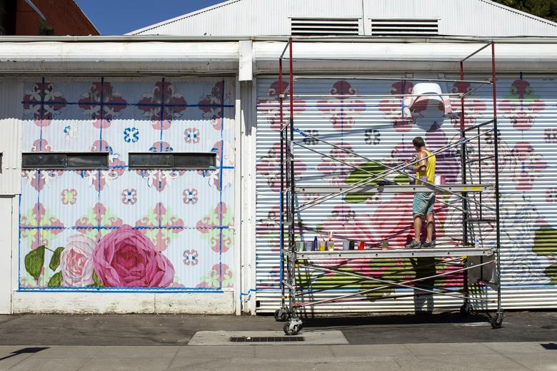 By mid-week, artist David Fiveash has made significant progress on his mural at 1025 R St. in Sacramento.