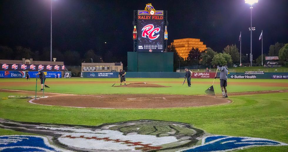 Crews groom the field after the team’s win on Aug. 20, where the Raley Field sign will be changed next year to Sutter Health Park. (Photo by Steve Martarano)