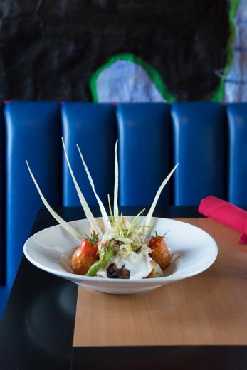 Black bean tamal with organic Stone Lake Farm tomatoes showered with a sundried-tomato vinaigrette and served with a trio of
housemade salsas. Black bean tamal with organic Stone Lake Farm tomatoes showered with a sundried-tomato vinaigrette and served with a trio of
housemade salsas.