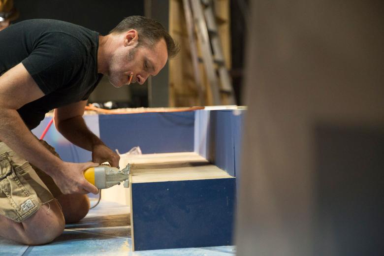 B Street Theatre’s scene shop foreman, Greg Parker , oversees the building of sets once build plans have been drafted by the technical director . B Street Theatre’s scene shop foreman, Greg Parker , oversees the building of sets once build plans have been drafted by the technical director .