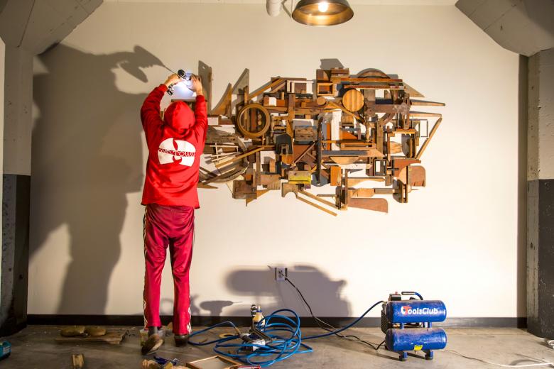 Burner assembles his sculpture in the WAL lobby Burner assembles his sculpture in the WAL lobby