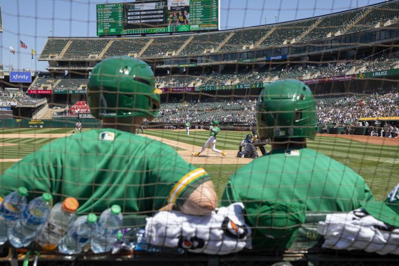 A’s ball boys watch Esteury Ruiz strike out in the 9th inning of Oakland’s 10-4 loss on June 29.