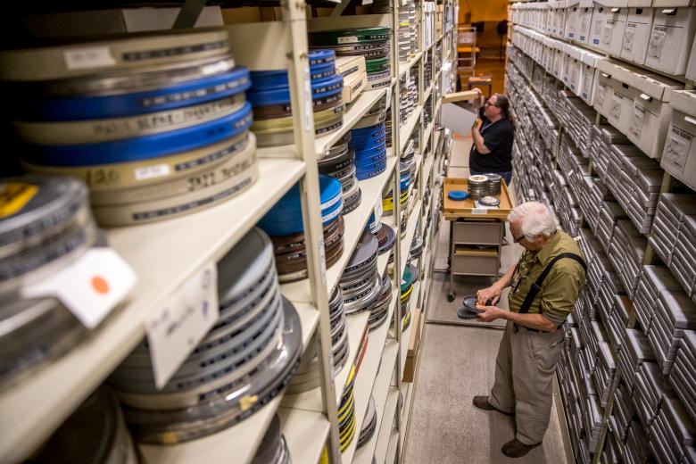 Deputy Historian and Manuscripts Archivist Dylan McDonald says the film archive gets “a lot of macabre requests.” Wearing cloth gloves to reduce scratches, Picht assembles requested reels by splicing clips and labeling each segment of the film