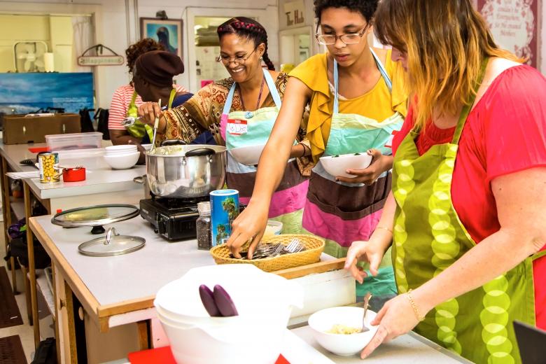 Victoria Jennings serves a bowl of broccoli and chick peas with brown rice as Zayah Lee and Leah Yadon (right) add parmesan cheese. "I wouldn't change a thing," Jennings says. Victoria Jennings serves a bowl of broccoli and chick peas with brown rice as Zayah Lee and Leah Yadon (right) add parmesan cheese. "I wouldn't change a thing," Jennings says.