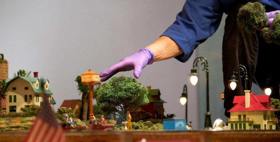 Four days a week, she climbs into a glass case on the third floor of the museum to delicately remove accumulated dirt and lubricate the curves of the track to avoid derailing the trains. Howard also pulls the trains out of the case to clean the wheels and do routine maintenance.