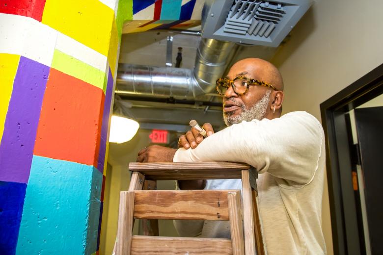 Concrete columns from the 1914 Lawrence Warehouse serve as artist Gerry Simpson's canvas Concrete columns from the 1914 Lawrence Warehouse serve as artist Gerry Simpson's canvas