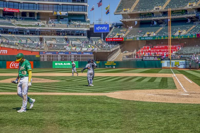 Oakland’s Ryan Noda strikes out to end the June 29 10-4 loss as the victorious New York Yankees celebrate.
