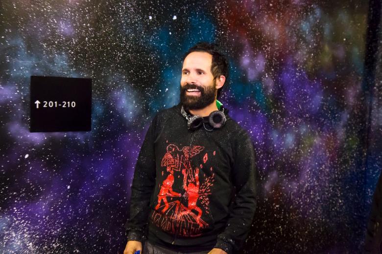 Jose Di Gregorio's process for creating his cosmic art can be broken down into four steps: 1.) Paint the walls black, 2.) add a layer of color, 3.) splatter the walls... Jose Di Gregorio's process for creating his cosmic art can be broken down into four steps: 1.) Paint the walls black, 2.) add a layer of color, 3.) splatter the walls...