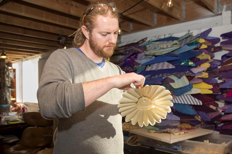 Danny Scheible of Tapigami makes sunflowers out of masking tape for the 6th floor elevator lobby Danny Scheible of Tapigami makes sunflowers out of masking tape for the 6th floor elevator lobby