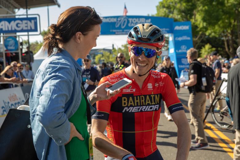 Australian racer Rohan Dennis speaks with a reporter in front of the Rancho Cordova start line May 13.