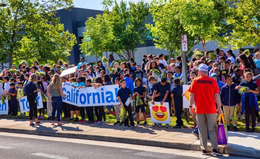 Students line White Rock Road to cheer the Tour of California racers. Around 500 students from seven of Rancho Cordova’s 19 schools went on a field trip to experience the Amgen Tour up close.