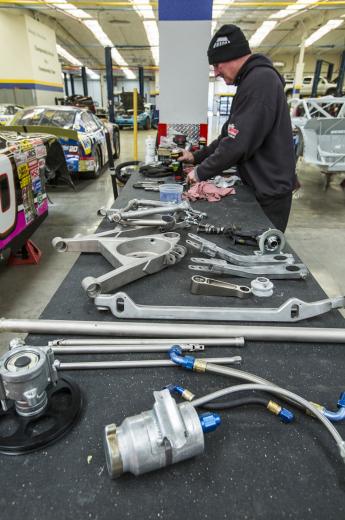 McAnally likens his shop to a college for drivers aspiring to join the world of high-speed racing. In a given year he estimates he evaluates two-dozen racers and chooses three to drive full-time. McAnally likens his shop to a college for drivers aspiring to join the world of high-speed racing. In a given year he estimates he evaluates two-dozen racers and chooses three to drive full-time.