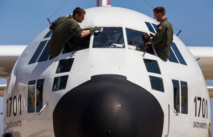 Avionics Electrical Technicians John Hagerty and Dan Boyd run routine maintenance on their aircraft before departure. Avionics Electrical Technicians John Hagerty and Dan Boyd run routine maintenance on their aircraft before departure.