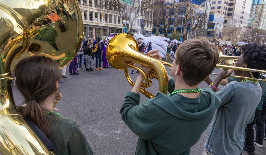 The parade came to a halt as the Sacramento State Marching Band performed several numbers.
