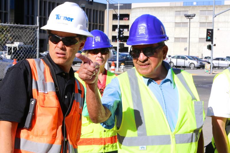 Artist Esteban Villa points out an area of interest to Jamie Brown of Turner Construction during a street tour around the perimeter of the new Golden 1 Center. Artist Esteban Villa points out an area of interest to Jamie Brown of Turner Construction during a street tour around the perimeter of the new Golden 1 Center.