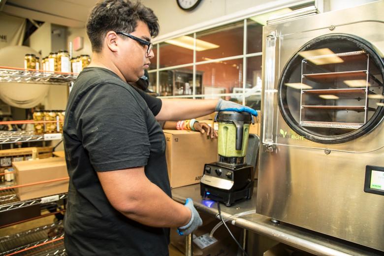 Once all the ingredients are prepped, Lopez purees them in small batches.