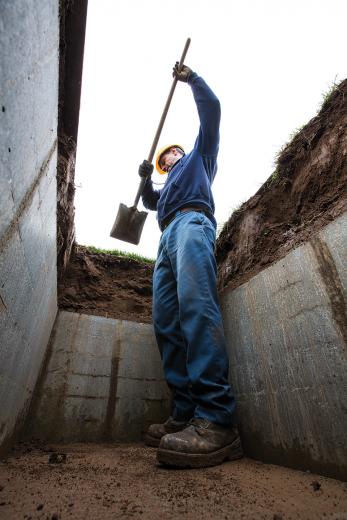 East Lawn Memorial Park has roots that go back more than 110 years — before “six feet under” was just a euphemism. Groundsman Nick Ustymchuk uncovers a concrete chamber, which will hold a casket or cremated remains