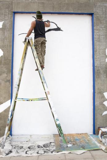 The business owner was so frustrated when volunteers painted over Padilla’s work that he hunted the young artist down and hired him to create murals first on the back and then on the front of the building. The business owner was so frustrated when volunteers painted over Padilla’s work that he hunted the young artist down and hired him to create murals first on the back and then on the front of the building.