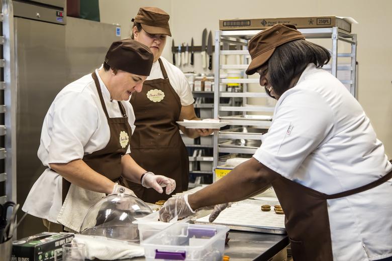 Jennifer Kaye (left), owner of About A Bite Bakery, assembles a sample tray with the help of employees Marina Bilevich and Veronica Briscoe. The bakery held its "soft opening" on Monday, July 13, at its new retail location at 1200 K Street in downtown Sacramento. Jennifer Kaye (left), owner of About A Bite Bakery, assembles a sample tray with the help of employees Marina Bilevich and Veronica Briscoe. The bakery held its "soft opening" on Monday, July 13, at its new retail location at 1200 K Street in downtown Sacramento.