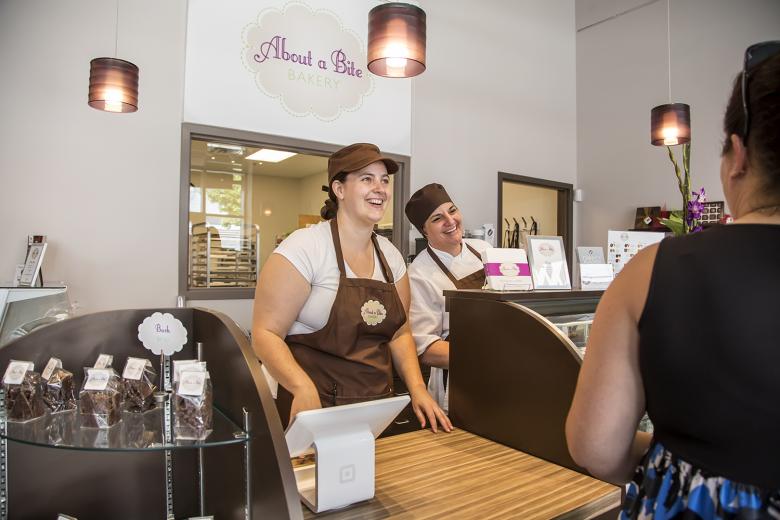 Stepphanie Nevin (left) and Jennifer Kaye, owner of About A Bite Bakery, wait on customers during a soft launch on Monday, July 13, 2015, at the new retail location at 1200 K Street in downtown Sacramento. About A Bite Bakery is sharing space with the new Downtown & Vine Harvest Bar. Stepphanie Nevin (left) and Jennifer Kaye, owner of About A Bite Bakery, wait on customers during a soft launch on Monday, July 13, 2015, at the new retail location at 1200 K Street in downtown Sacramento. About A Bite Bakery is sharing space with the new Downtown & Vine Harvest Bar.
