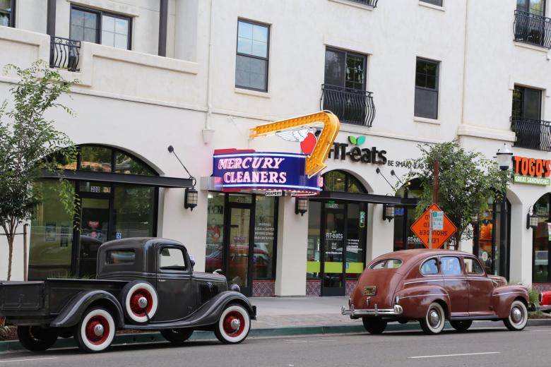 Antique cars from the 1940s framed the sign as it was lit for the first time in years. Once again, Mercury Cleaners is a beacon on 16th Street. Antique cars from the 1940s framed the sign as it was lit for the first time in years. Once again, Mercury Cleaners is a beacon on 16th Street.