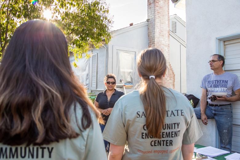Homeowners Aleathea and Stewart Howe brief a team of volunteers from the Community Engagement Center at California State University at Sacramento. During the 26th annual Paint the Town event sponsored by NeighborWorks Sacramento, volunteers painted and repaired 10 homes in South Oak Park. Homeowners Aleathea and Stewart Howe brief a team of volunteers from the Community Engagement Center at California State University at Sacramento. During the 26th annual Paint the Town event sponsored by NeighborWorks Sacramento, volunteers painted and repaired 10 homes in South Oak Park.